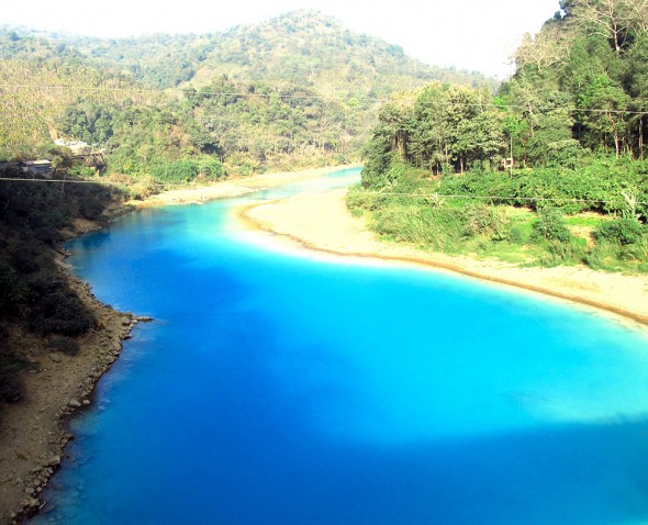 The Lukha River, near the border with Bangladesh, runs Gatorade blue due to sulphate pollution from Meghalaya's coal mines.